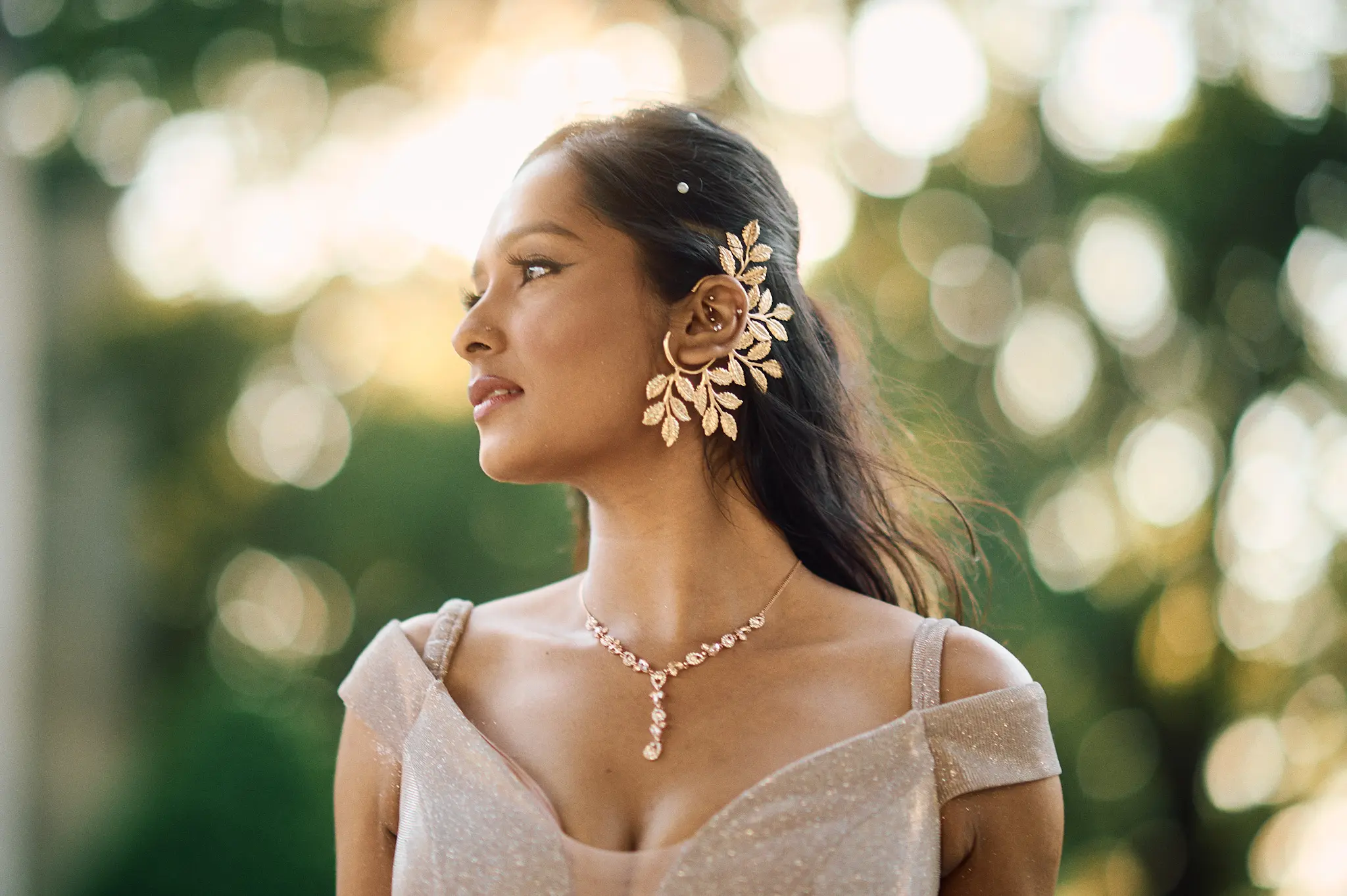 Girl looking toward the golden hour sunset